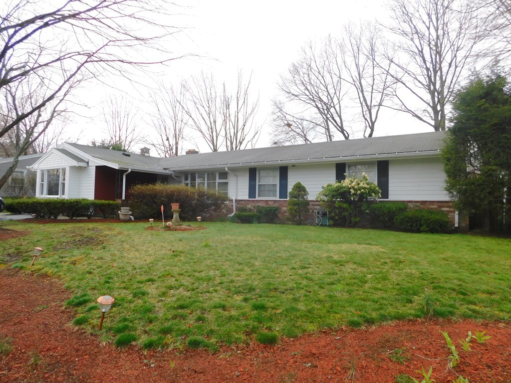 44 Delmar Road Brockton, MA 02302 - Photo 2 of 19 a front view of a house with a garden