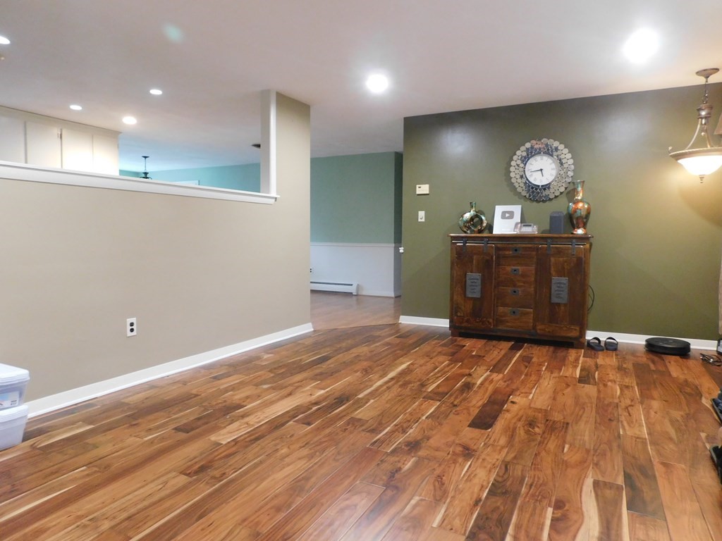 44 Delmar Road Brockton, MA 02302 - Photo 3 of 19 a view of a room with a bed and wooden floor