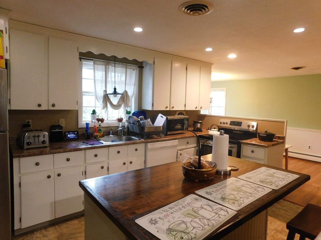 44 Delmar Road Brockton, MA 02302 - Photo 6 of 19 a kitchen with stainless steel appliances granite countertop a sink counter space and cabinets