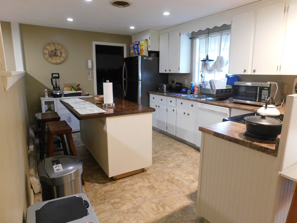 44 Delmar Road Brockton, MA 02302 - Photo 7 of 19 a kitchen with a sink appliances and cabinets
