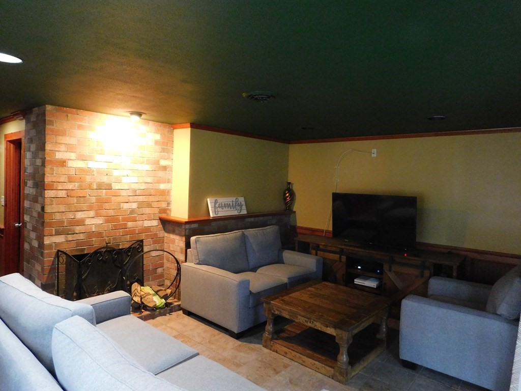 44 Delmar Road Brockton, MA 02302 - Photo 8 of 19 a living room with furniture and a flat screen tv