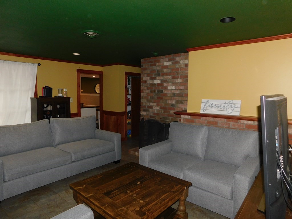 44 Delmar Road Brockton, MA 02302 - Photo 9 of 19 a living room with furniture and a flat screen tv