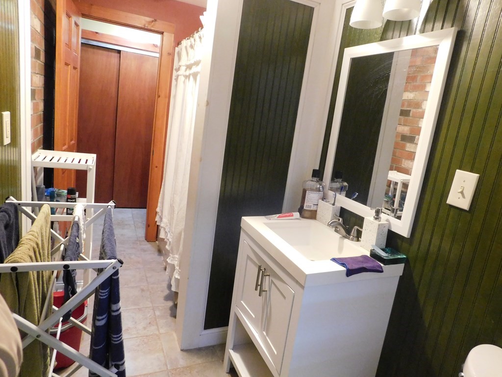 44 Delmar Road Brockton, MA 02302 - Photo 10 of 19 a bathroom with a sink and a mirror