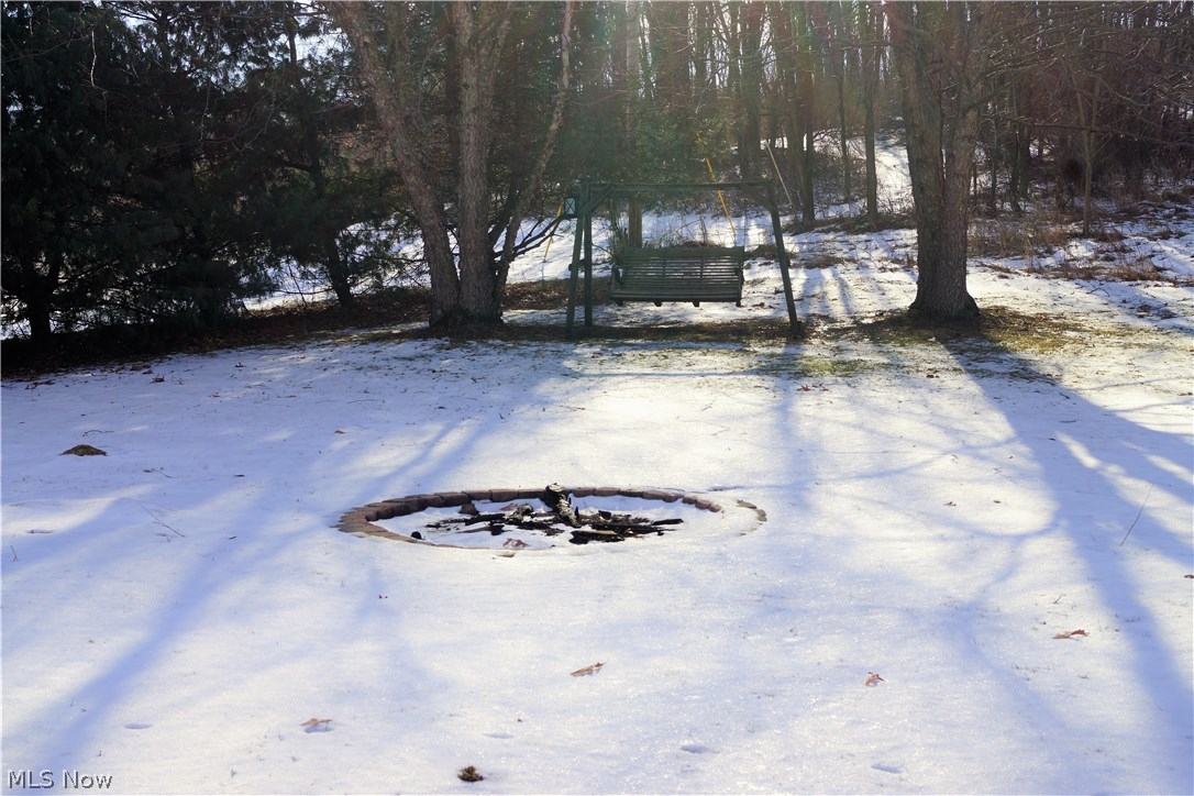 11044 Walker Road Minerva, OH 44657 - Photo 24 of 28 AFTER THE SNOW MELTS ENJOY SUMMERS WITH A NICE FIRE IN THE FIRE PIT!
