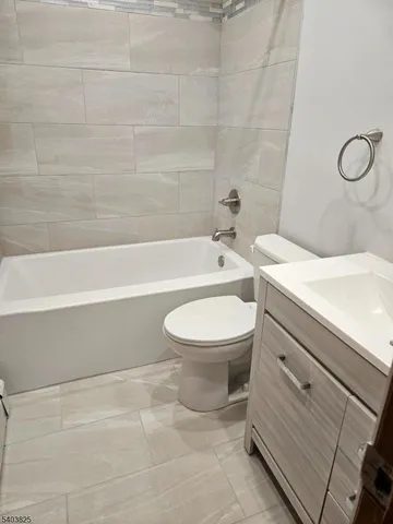 a bathroom with a sink a toilet and a bathtub