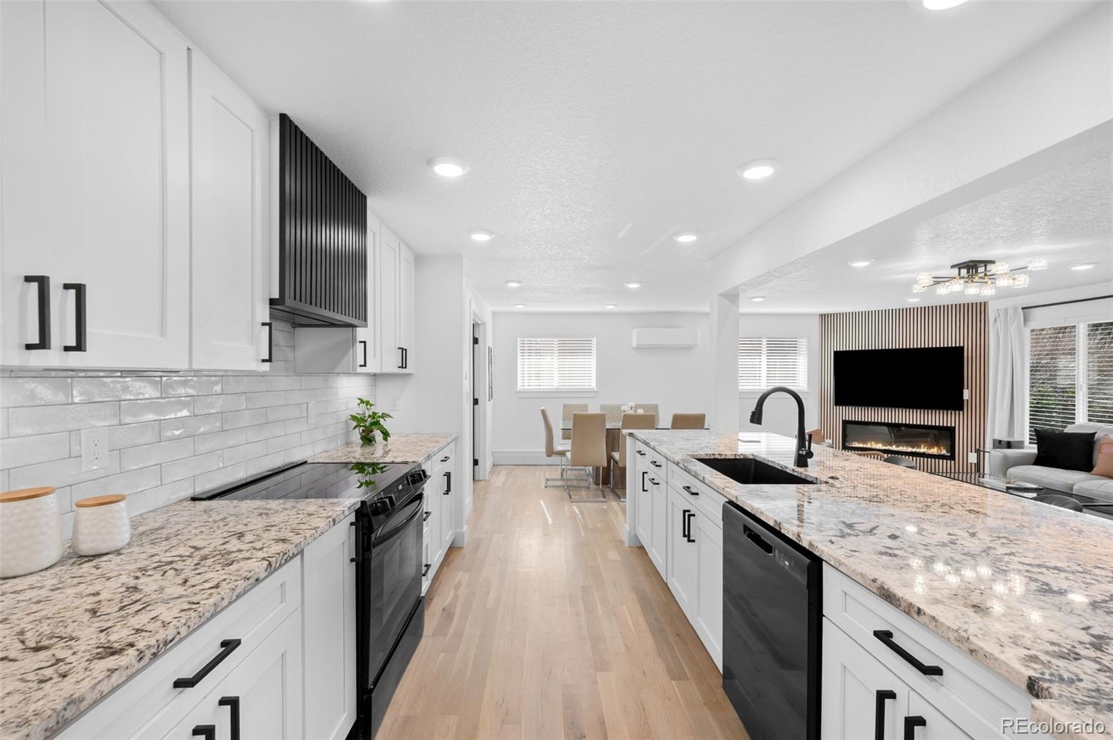 3860 Dudley Street Wheat Ridge, CO 80033 - Photo 11 of 35 a kitchen with a sink stove top oven and refrigerator