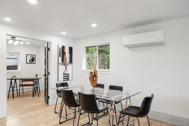 a view of a dining room with furniture and window