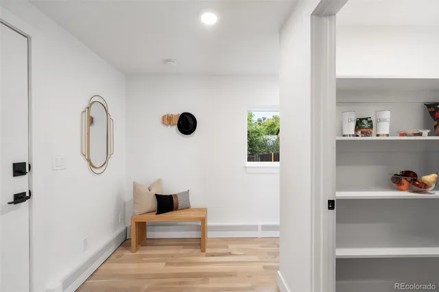 a bedroom with a bed and a potted plant