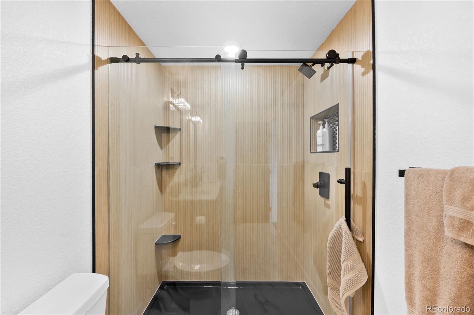 3860 Dudley Street Wheat Ridge, CO 80033 - Photo 18 of 35 a bathroom with a shower and a toilet