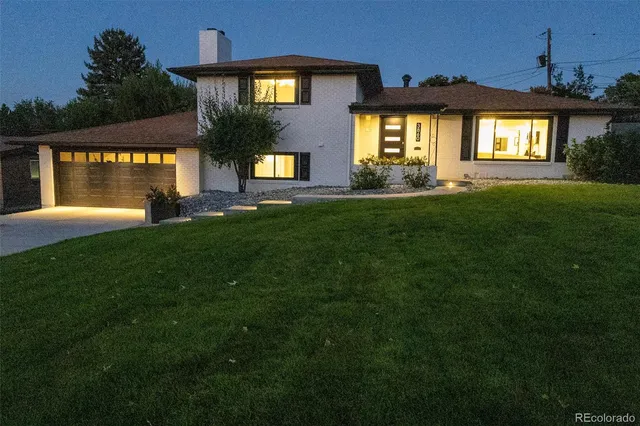 a living room with furniture a rug and a flat screen tv