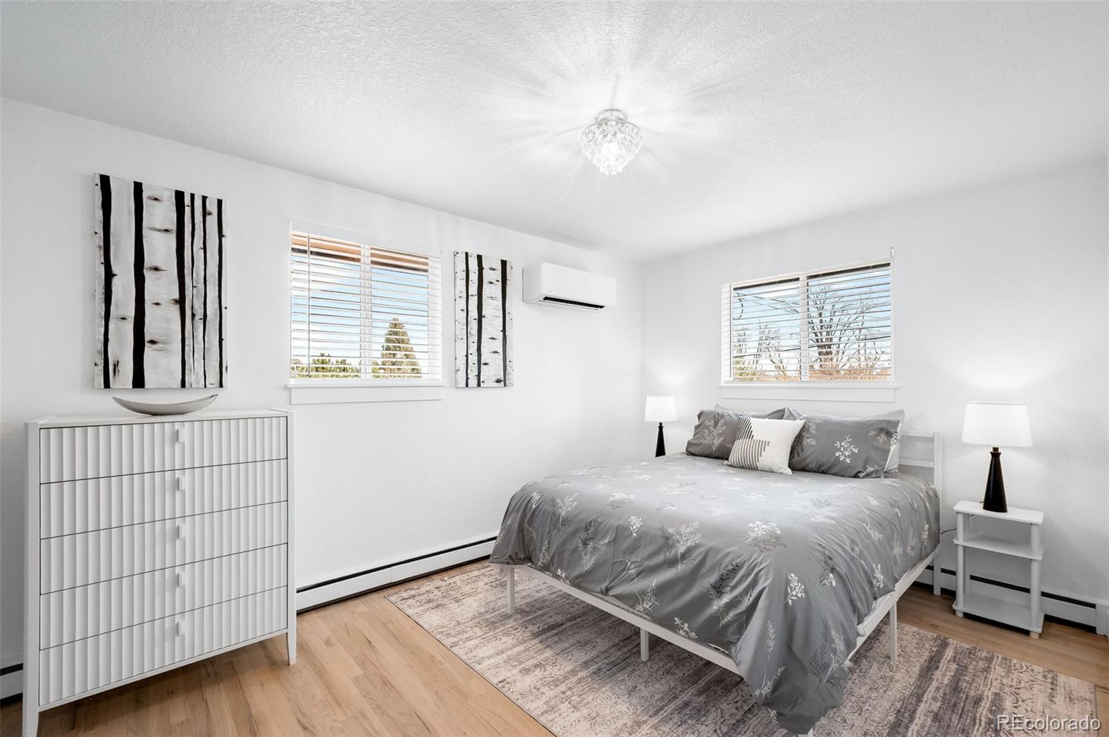 3860 Dudley Street Wheat Ridge, CO 80033 - Photo 23 of 35 a bedroom with a large bed and a window