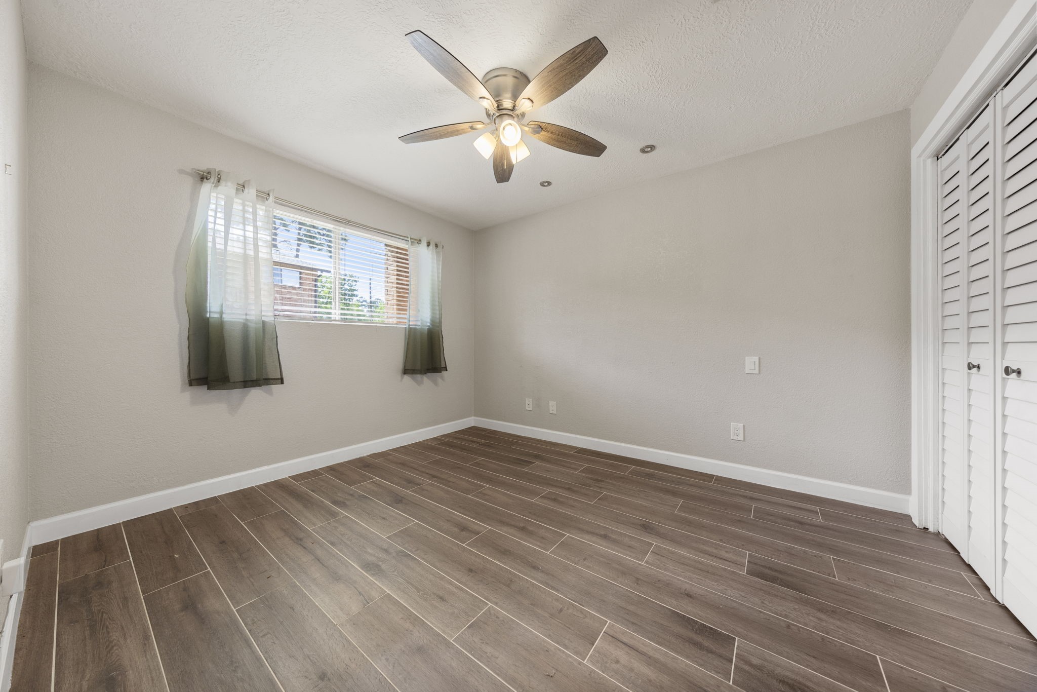 801 River Road, Unit 105C Montgomery, TX 77356 - Photo 16 of 30 Enjoy a private primary retreat positioned at the front of the unit, featuring a comfortable layout and serene atmosphere.