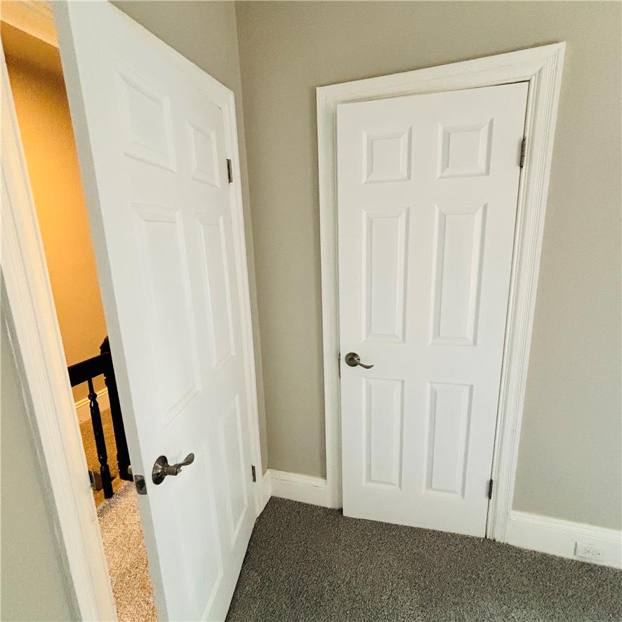 718 Linden Street Bethlehem, PA 18018 - Photo 15 of 19 Two paneled doors lead to various areas of the home, complemented by soft carpeting.