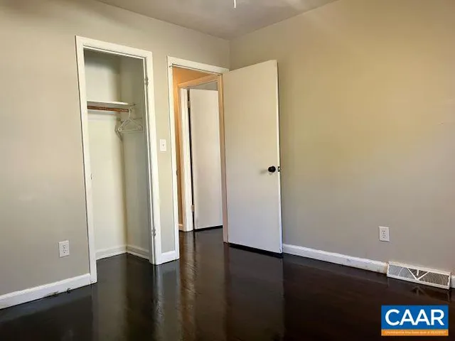 an entryway with wooden floor