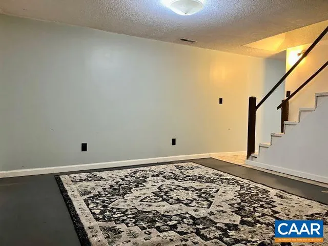 a bedroom with a bed and dresser