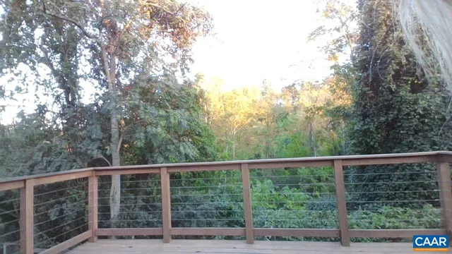 a view of a forest from a balcony