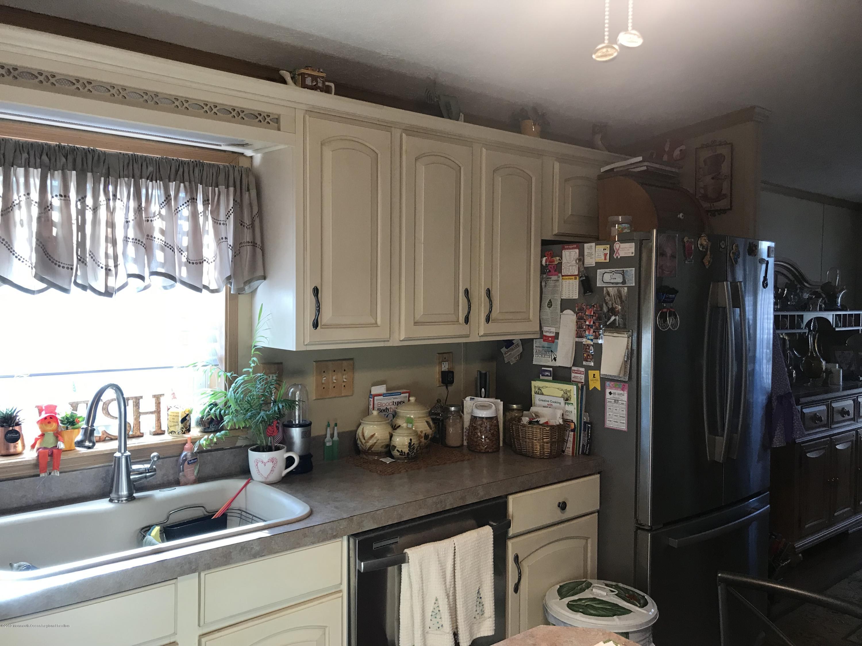 204 Roberts Road Toms River, NJ 08755 - Photo 14 of 19 a kitchen with a sink and cabinets