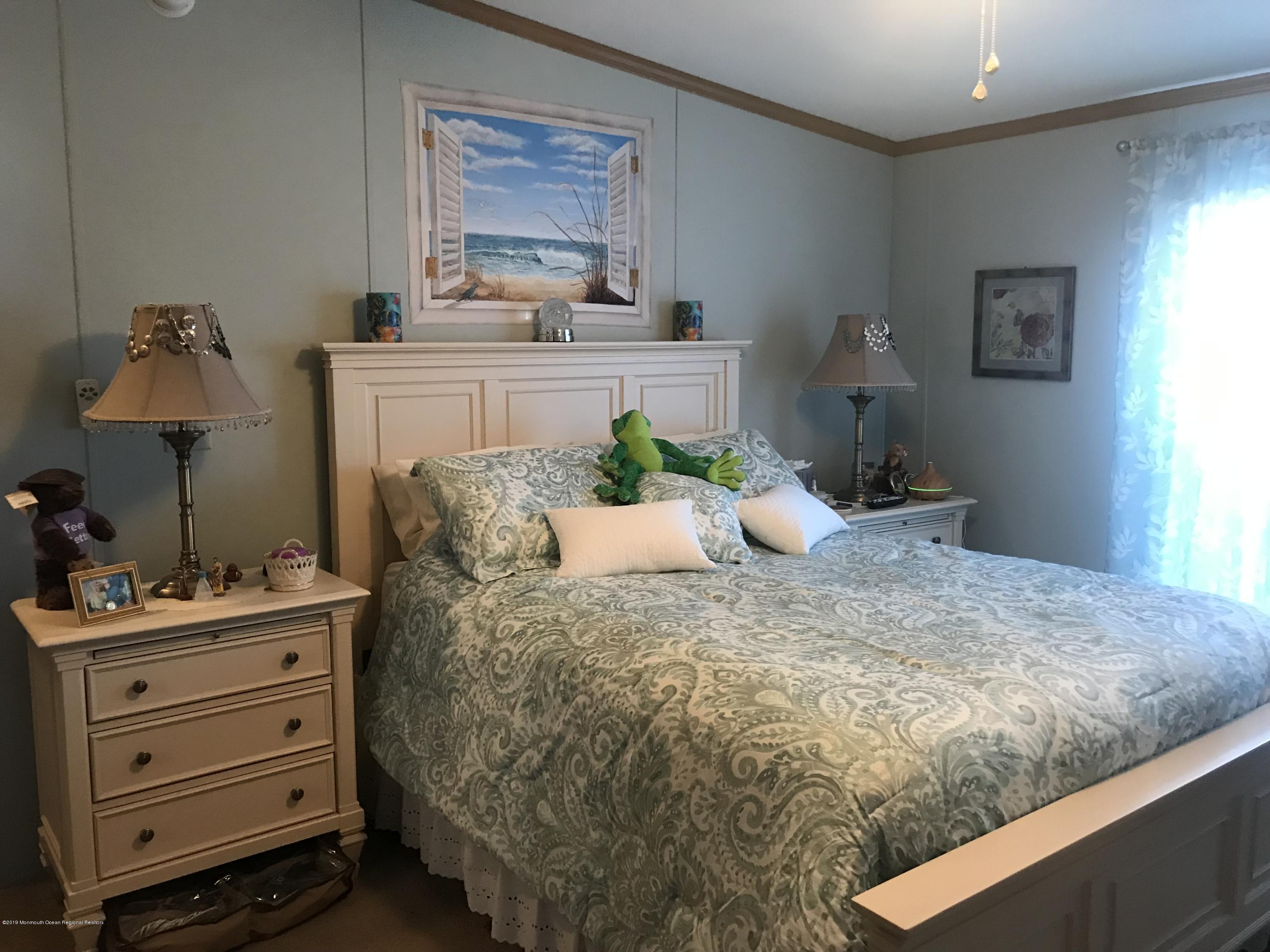 204 Roberts Road Toms River, NJ 08755 - Photo 16 of 19 a bedroom with a bed and a potted plant