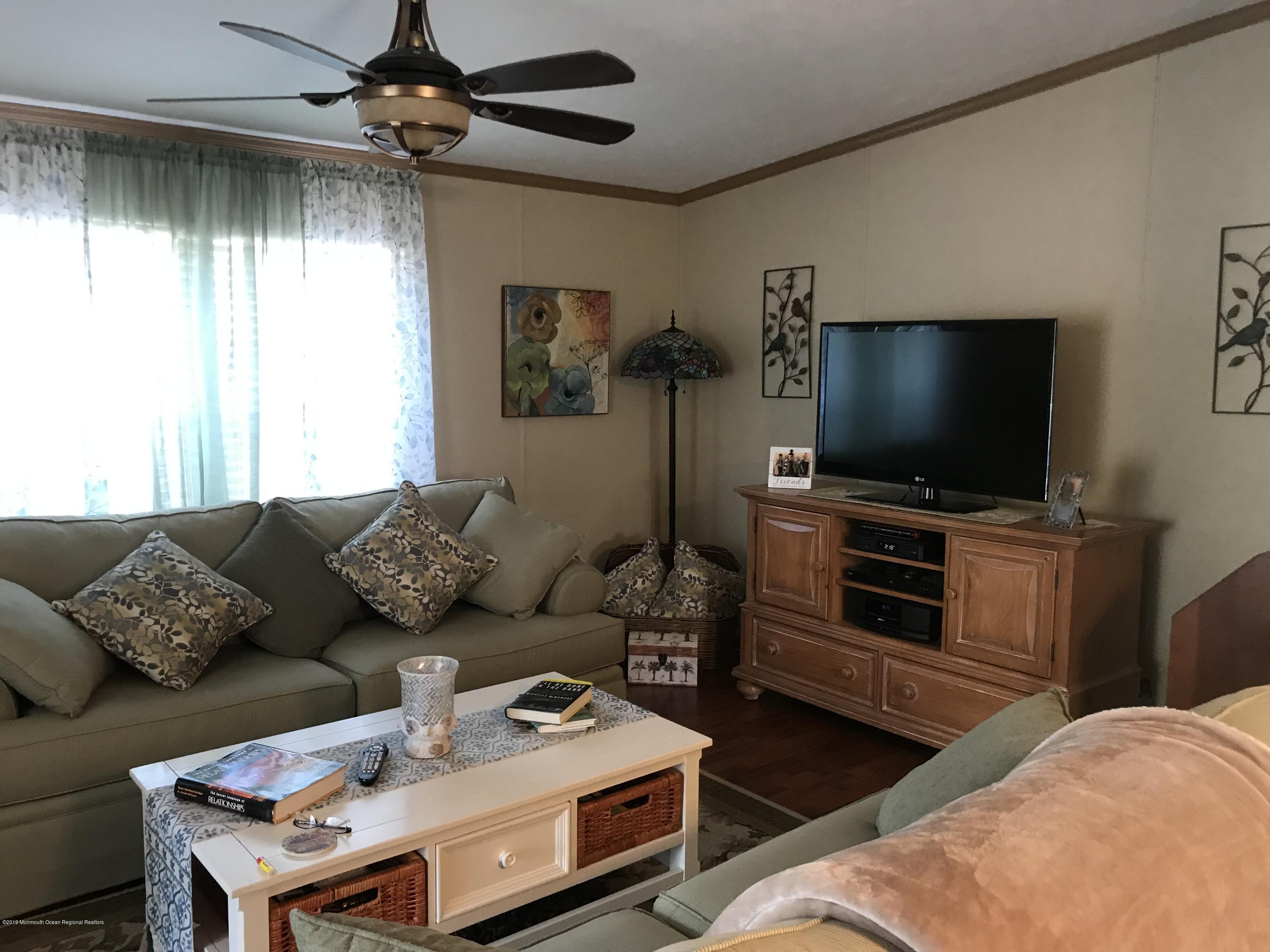 204 Roberts Road Toms River, NJ 08755 - Photo 10 of 19 a living room with furniture and a flat screen tv