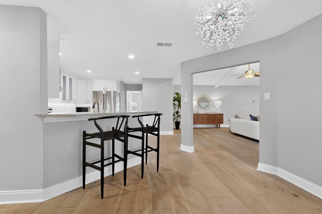 7631 Meadow Road Dallas, TX 75230 - Photo 11 of 40 A bright breakfast room adjacent to the kitchen area