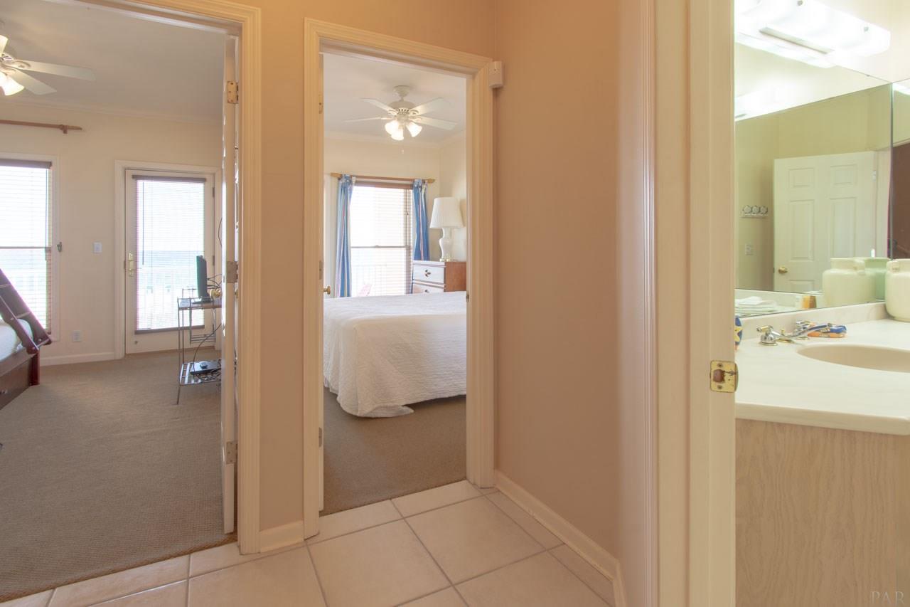 7961 Gulf Boulevard, Unit 2 Navarre Beach, FL 32566 - Photo 14 of 38 2 Gulf side bedrooms and full bathroom entries