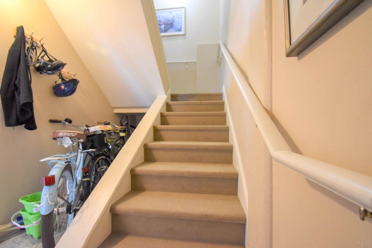 7961 Gulf Boulevard, Unit 2 Navarre Beach, FL 32566 - Photo 33 of 38 Stairwell with bike storage