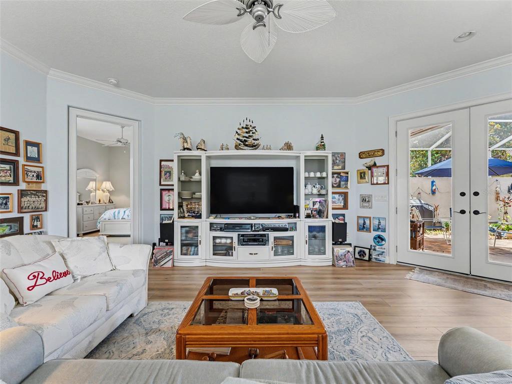 8910 Jericho Road Weeki Wachee, FL 34613 - Photo 20 of 52 a living room with furniture and a flat screen tv