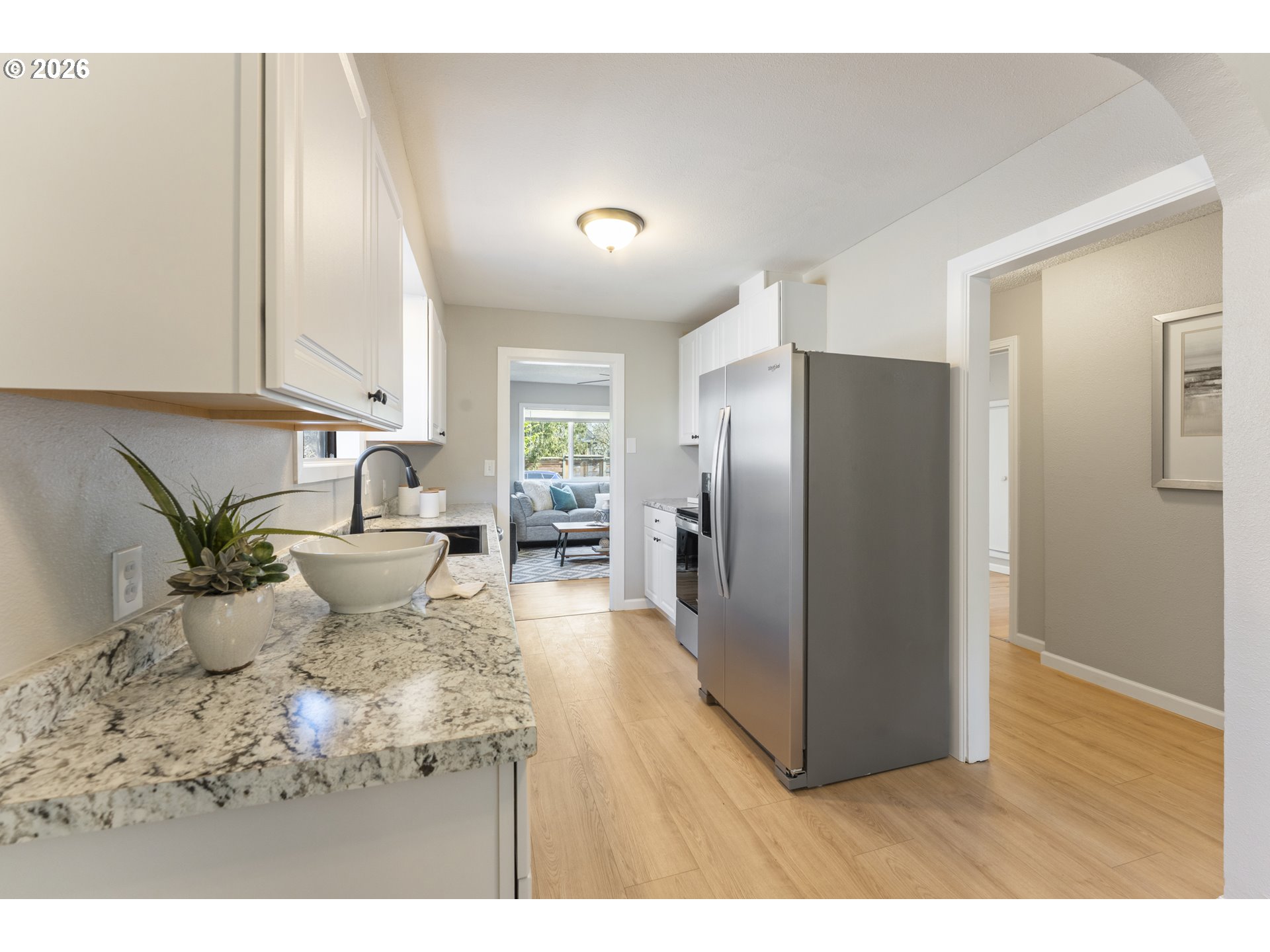 7915 North Exeter Avenue Portland, OR 97203 - Photo 11 of 34 a living room with furniture wooden floor and a refrigerator