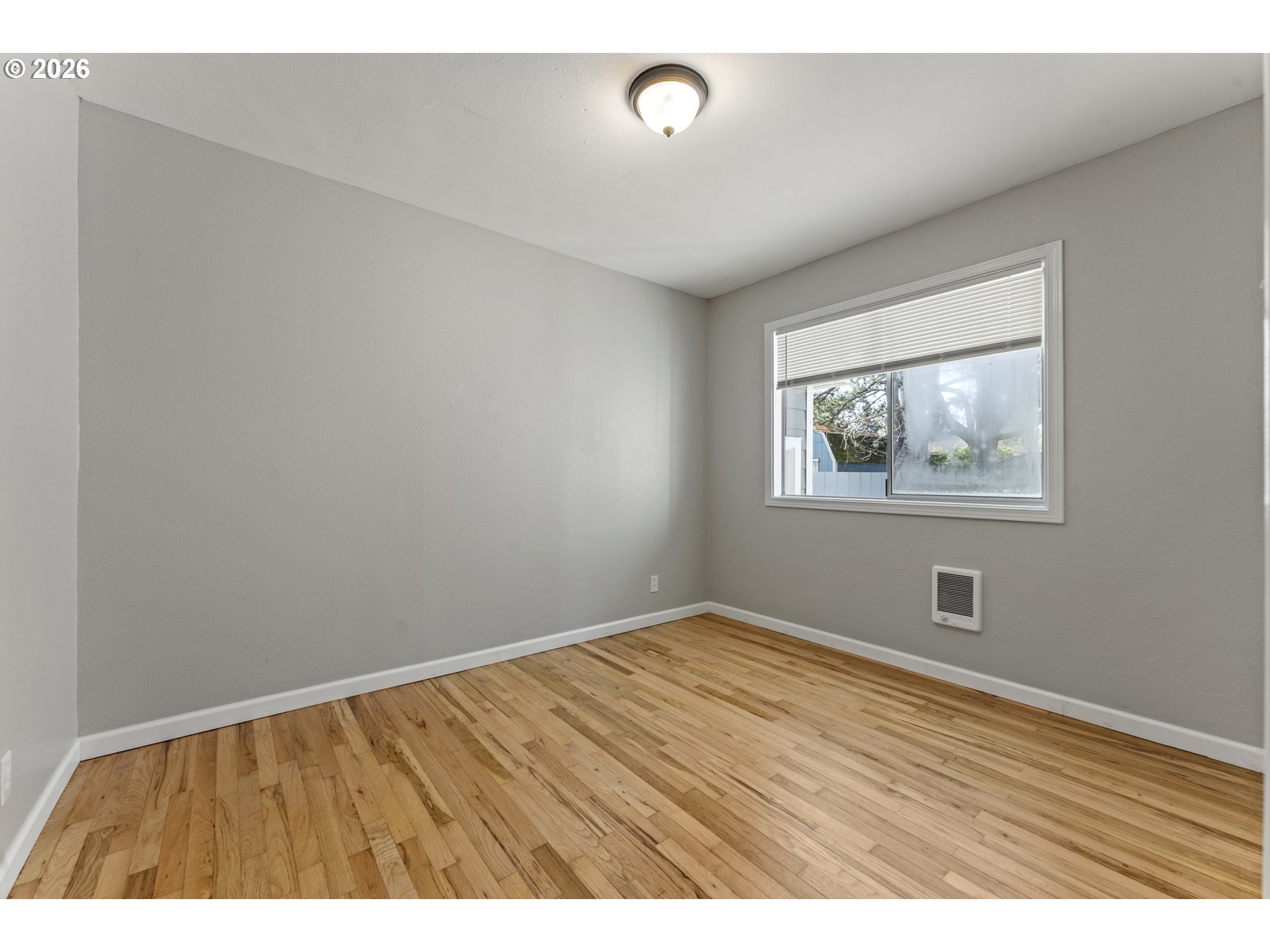 7915 North Exeter Avenue Portland, OR 97203 - Photo 18 of 34 a view of an empty room with wooden floor