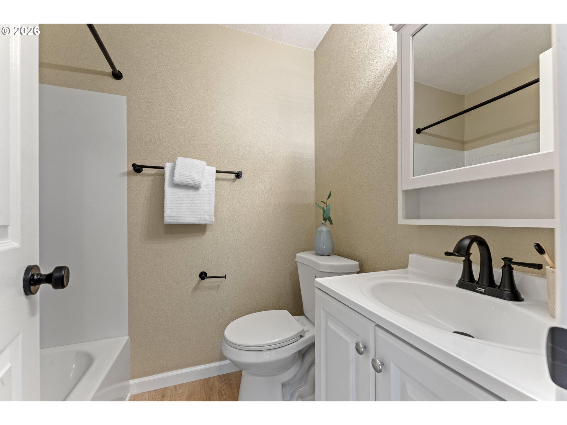 7915 North Exeter Avenue Portland, OR 97203 - Photo 23 of 34 a bathroom with a sink mirror vanity and toilet