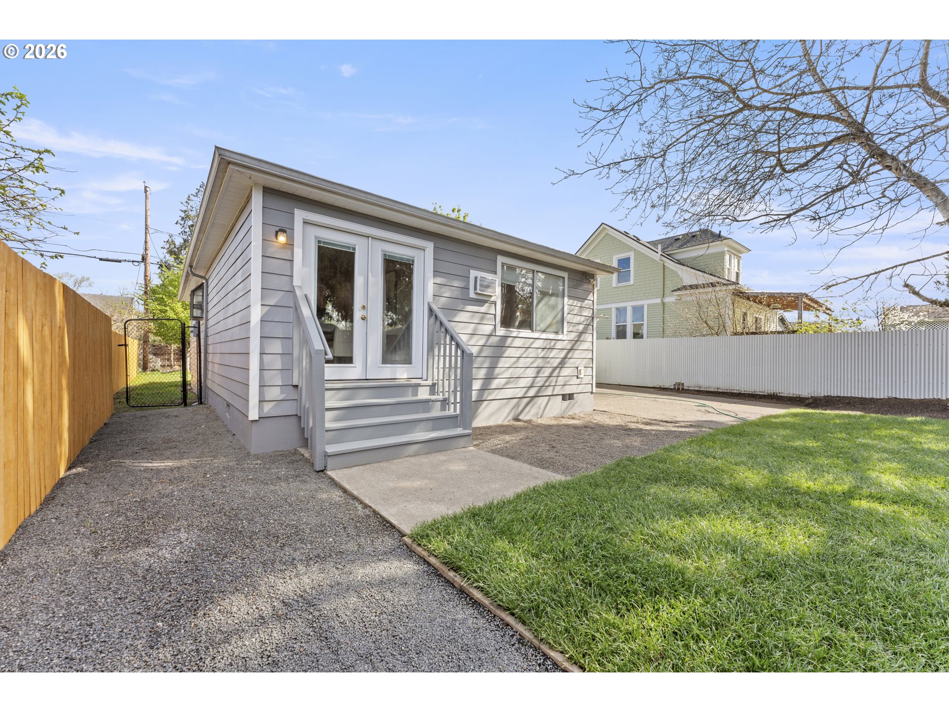 7915 North Exeter Avenue Portland, OR 97203 - Photo 28 of 34 a front view of a house with a yard and garage