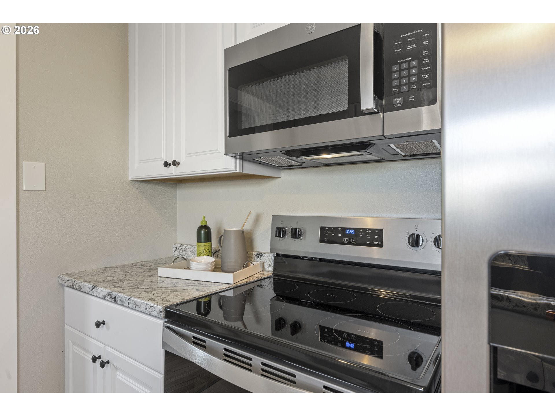 7915 North Exeter Avenue Portland, OR 97203 - Photo 10 of 34 a kitchen with a stove and a microwave