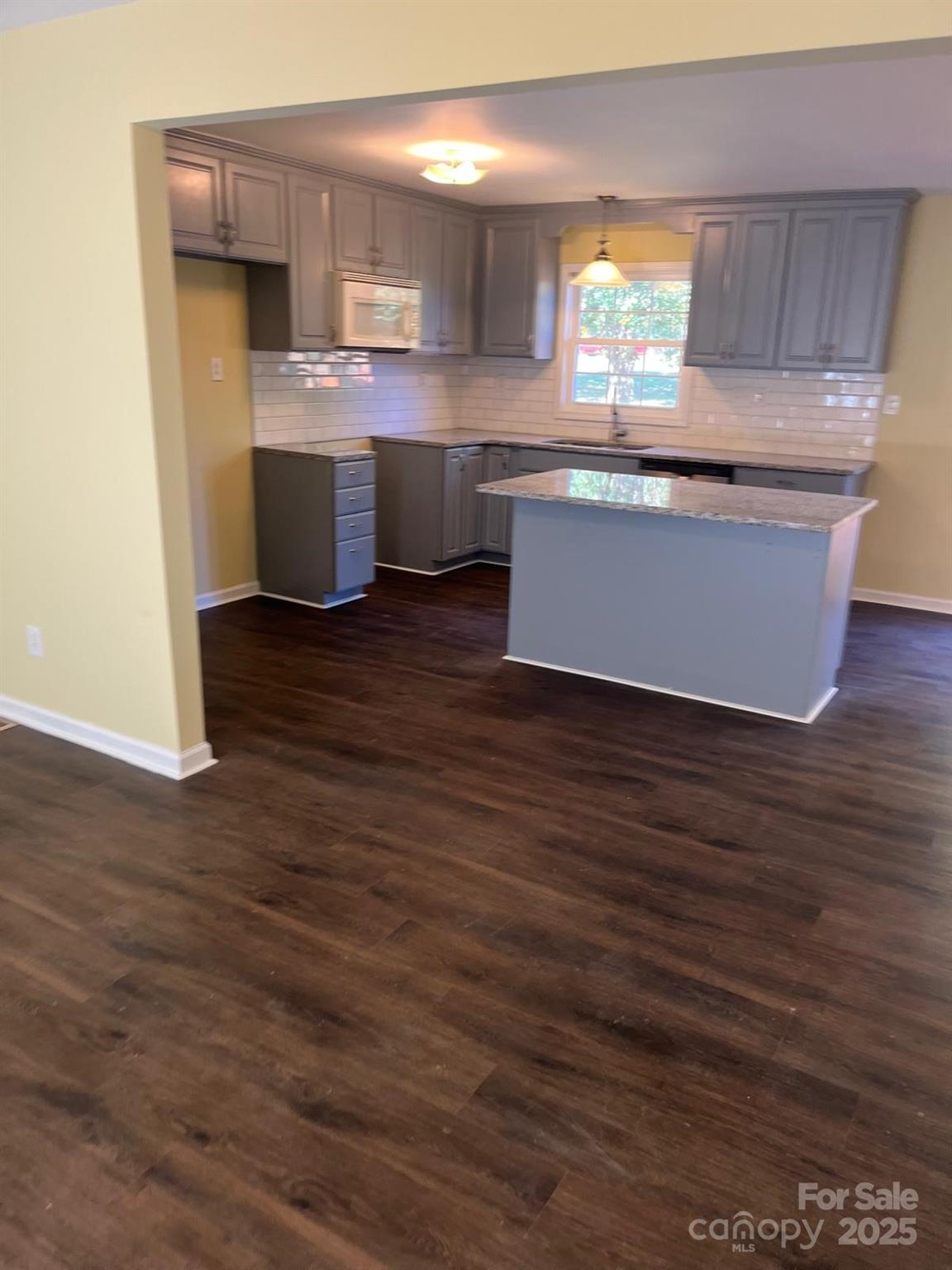104 Edison Street Kings Mountain, NC 28086 - Photo 13 of 28 a kitchen with stainless steel appliances granite countertop a sink window and cabinets