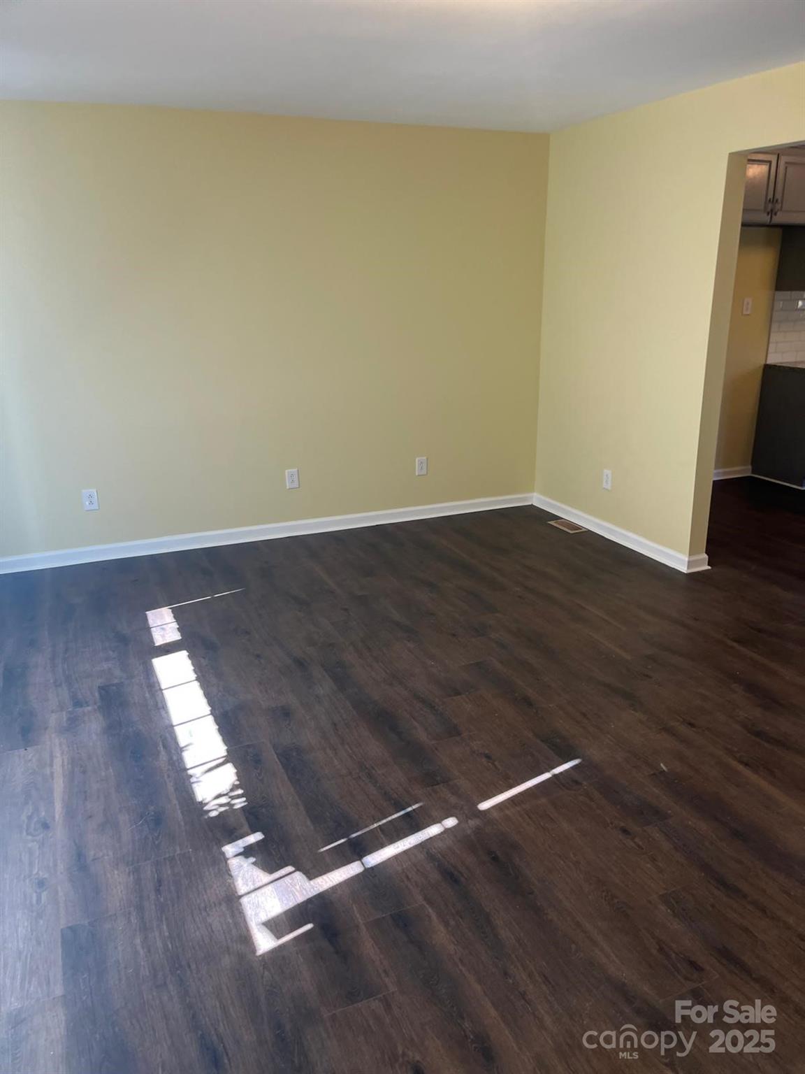 104 Edison Street Kings Mountain, NC 28086 - Photo 15 of 28 a view of wooden floor in an empty room
