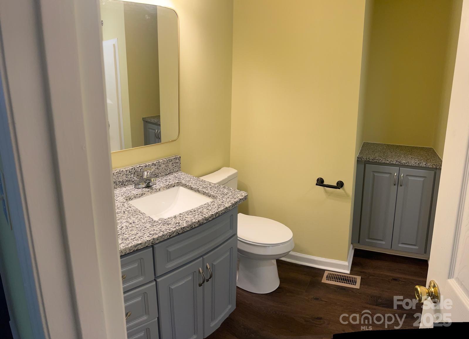 104 Edison Street Kings Mountain, NC 28086 - Photo 16 of 28 a bathroom with a granite countertop sink and a mirror