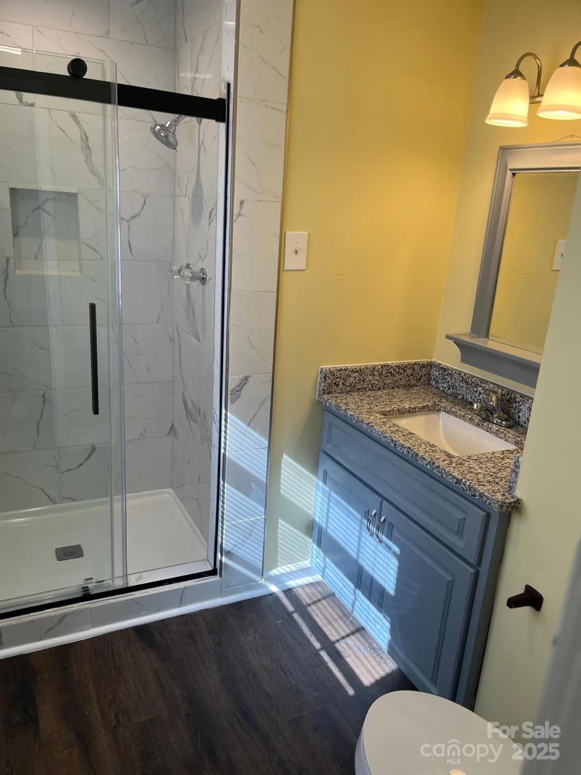 104 Edison Street Kings Mountain, NC 28086 - Photo 22 of 28 a bathroom with a granite countertop sink and a mirror