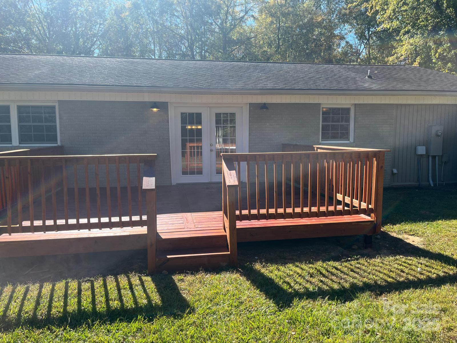 104 Edison Street Kings Mountain, NC 28086 - Photo 7 of 28 a view of a wooden deck with a bench