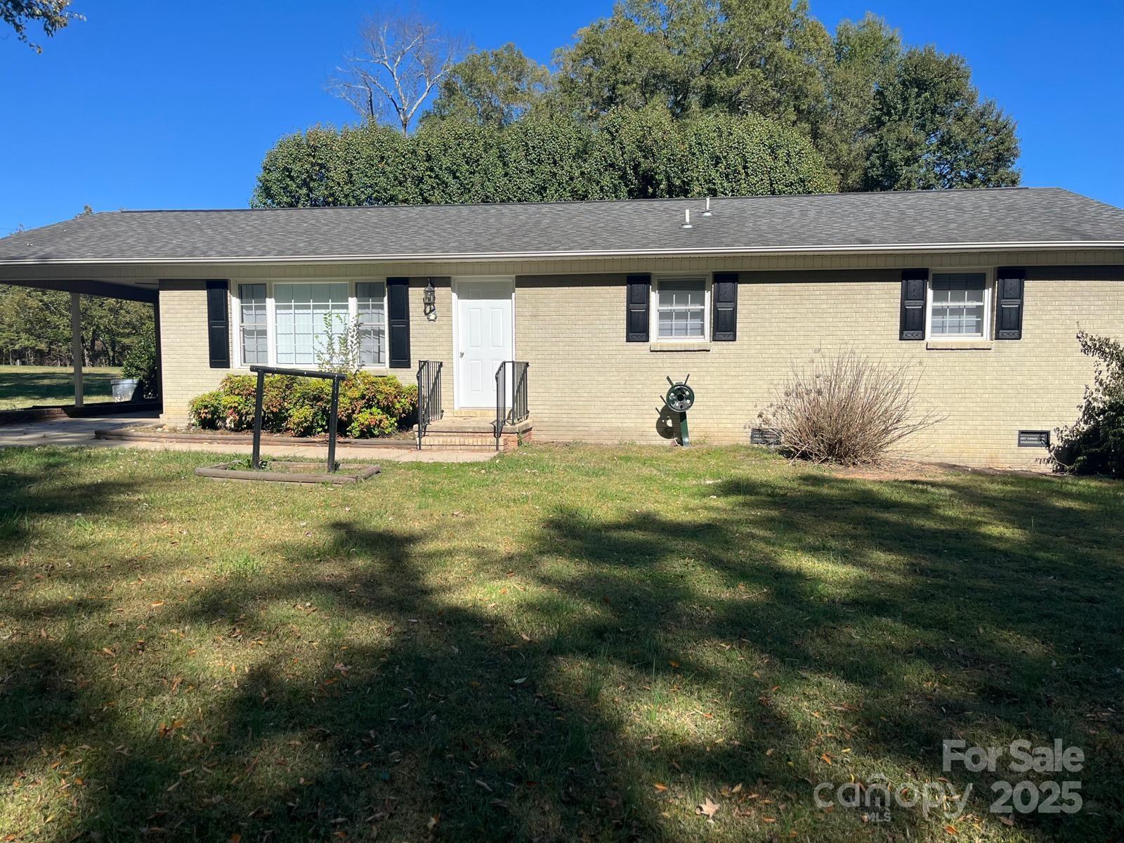 104 Edison Street Kings Mountain, NC 28086 - Photo 9 of 28 a front view of a house with a yard