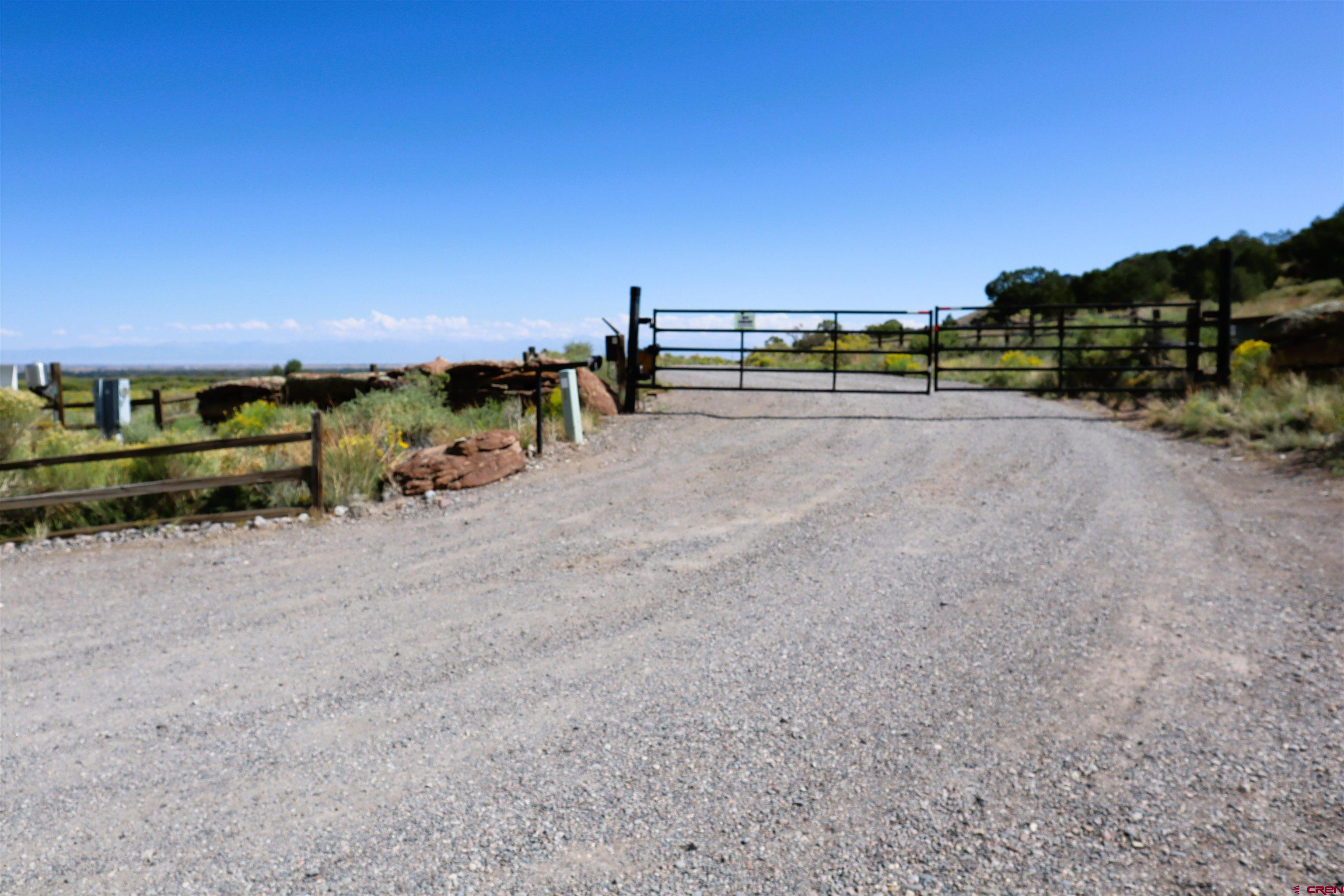 36 Wapiti Ridge Road Del Norte, CO 81132 - Photo 2 of 7 a view of a road with lawn chairs