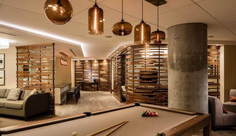 4-75 48th Avenue, Unit 1502 Queens, NY 11109 - Photo 7 of 12 a room with gym equipment