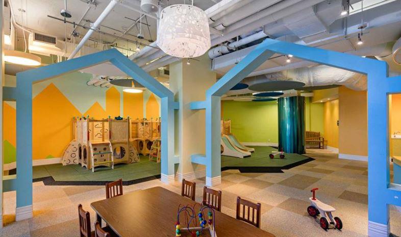 4-75 48th Avenue, Unit 1502 Queens, NY 11109 - Photo 9 of 12 a room with lots of tables and chairs