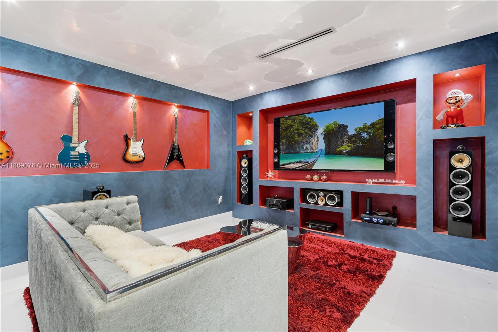 6763 Southwest 106th Place Miami, FL 33173 - Photo 11 of 38 a living room with furniture and a flat screen tv