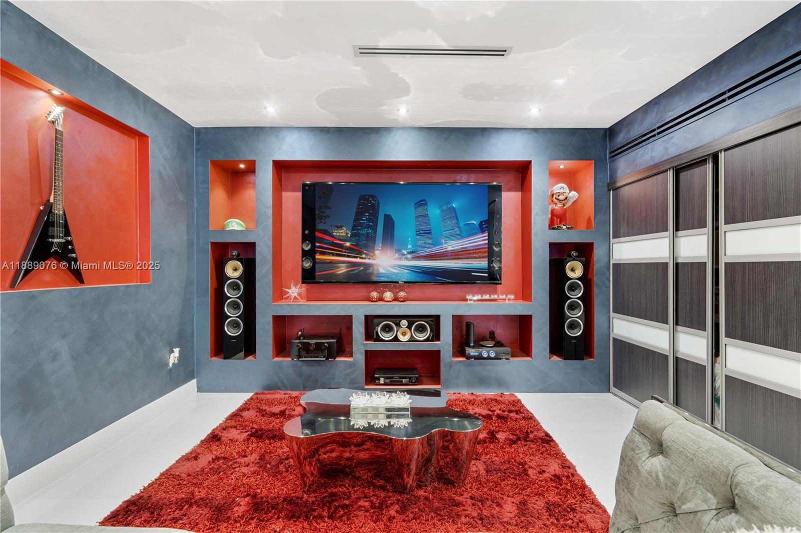 6763 Southwest 106th Place Miami, FL 33173 - Photo 14 of 38 a living room with fireplace furniture and a flat screen tv