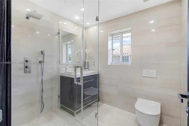 a view of walk in closet with clothes