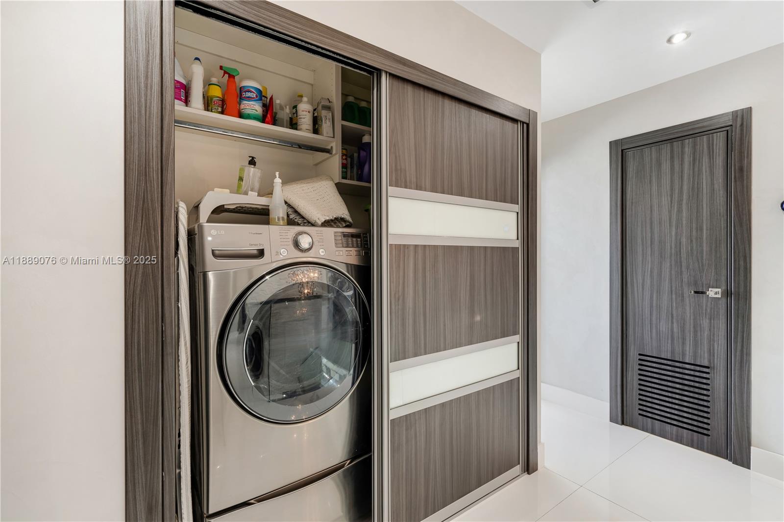 6763 Southwest 106th Place Miami, FL 33173 - Photo 23 of 38 a utility room with dryer and washer