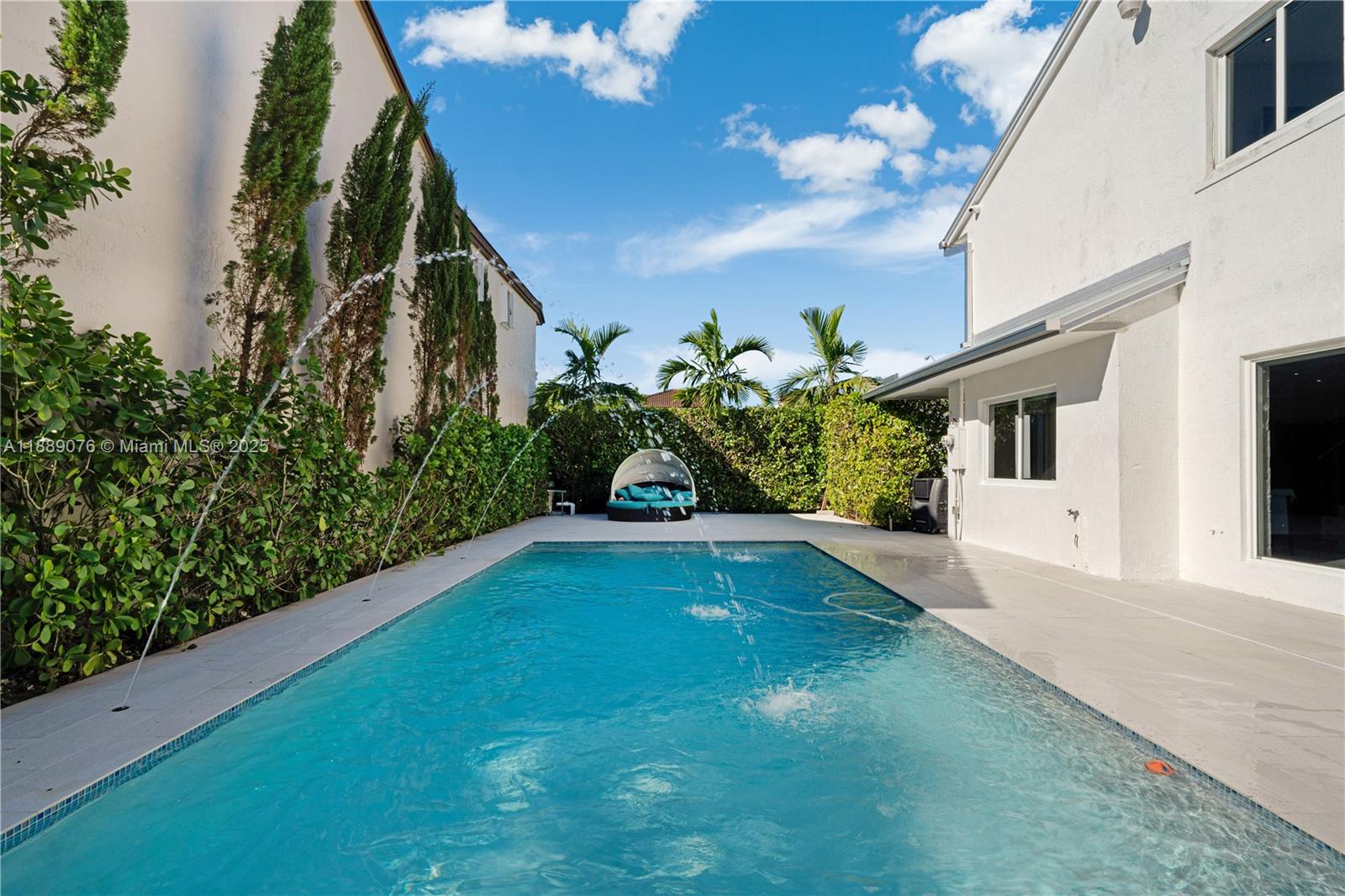 6763 Southwest 106th Place Miami, FL 33173 - Photo 26 of 38 a view of a house with a yard
