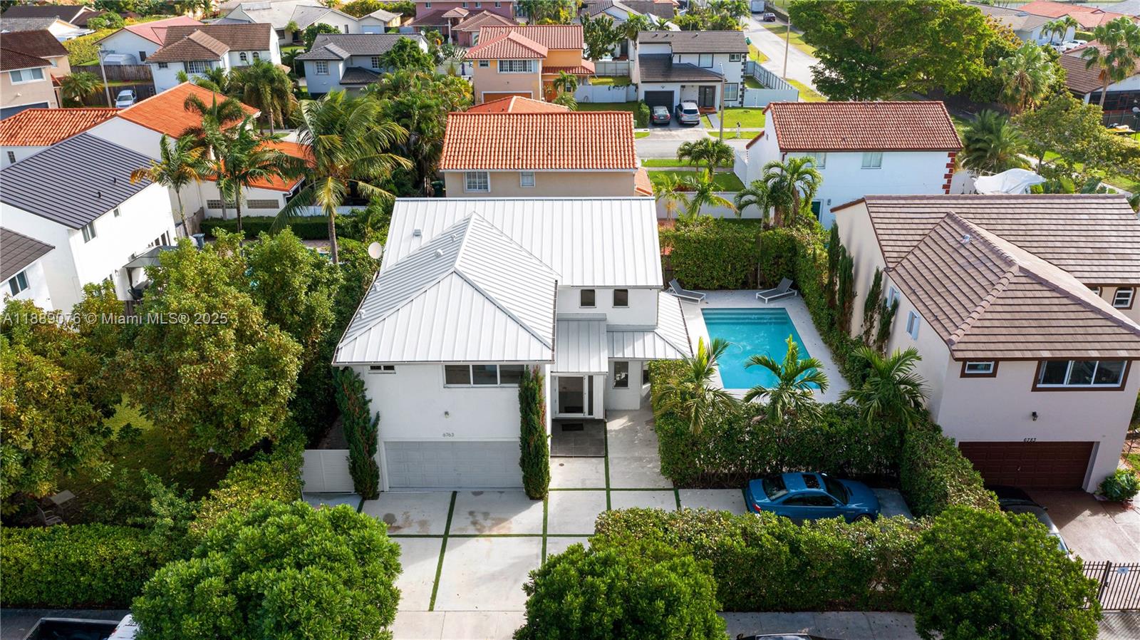 6763 Southwest 106th Place Miami, FL 33173 - Photo 3 of 38 an aerial view of multiple houses with yard