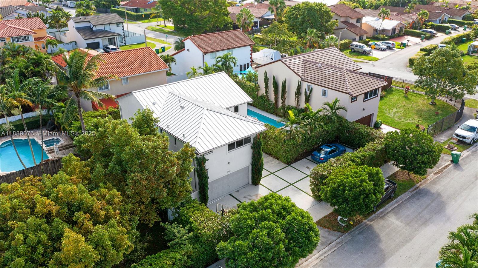 6763 Southwest 106th Place Miami, FL 33173 - Photo 31 of 38 an aerial view of residential houses with outdoor space and street view