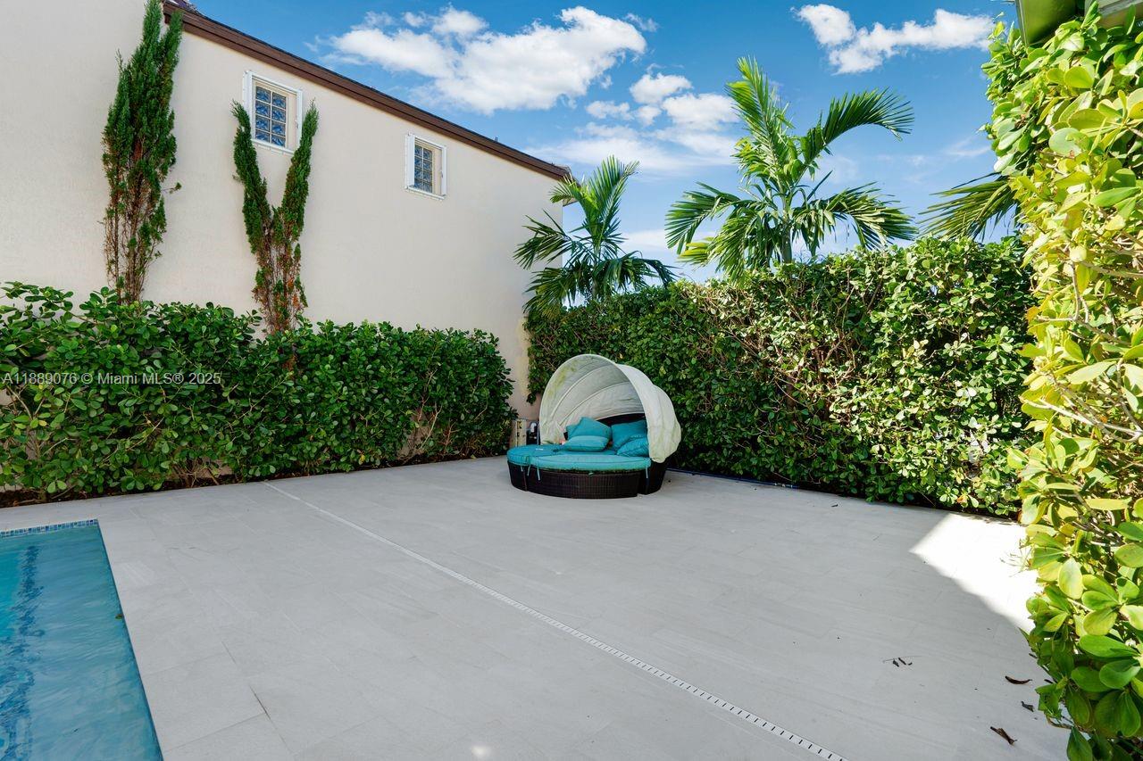 6763 Southwest 106th Place Miami, FL 33173 - Photo 36 of 38 a view of a back yard with potted plants