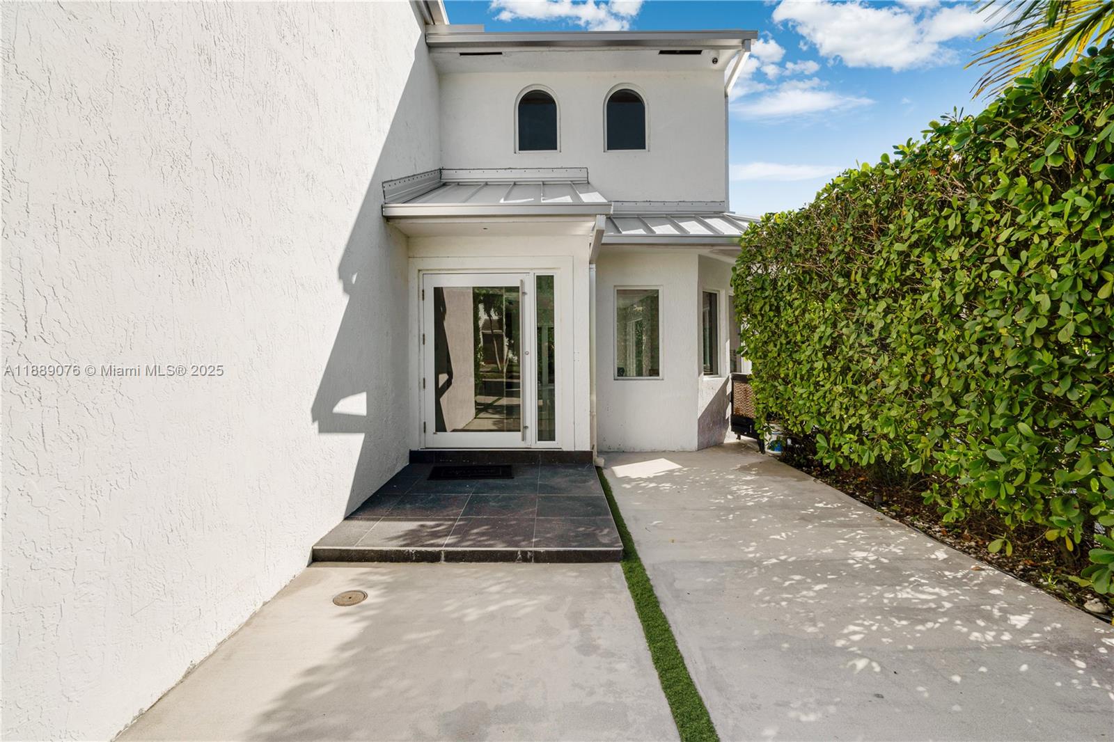 6763 Southwest 106th Place Miami, FL 33173 - Photo 37 of 38 a view of a house with a white door